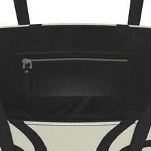 Load image into Gallery viewer, Close-up of a black bag with a zipper and geometric pattern.
