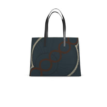Load image into Gallery viewer, Dark blue tote bag with circular pattern and metallic handle on a white background