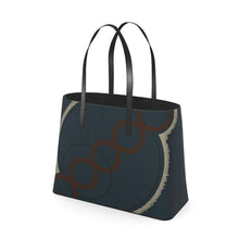 Load image into Gallery viewer, Black tote bag with circular design on a white background