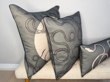 Load image into Gallery viewer, Decorative pillows with intricate patterns on a light-colored surface.