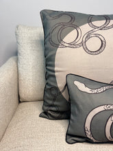 Load image into Gallery viewer, Decorative pillows with circular patterns on a beige sofa.