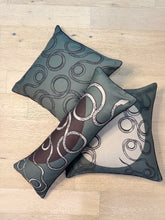 Load image into Gallery viewer, Three decorative pillows with abstract patterns on a wooden surface