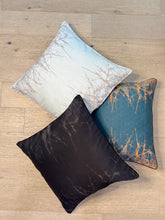 Load image into Gallery viewer, Three decorative pillows with different patterns on a wooden surface