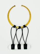 Load image into Gallery viewer, A brass collar necklace with yellow brass rods and black leather cords, featuring a selenite stone rod.