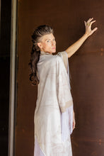 Load image into Gallery viewer, Woman in a light-colored dress against a brown background