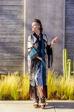 Load image into Gallery viewer, Woman in a stylish outfit standing outdoors with a cactus in the background