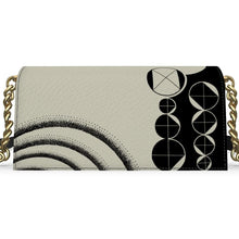 Load image into Gallery viewer, Handbag with geometric design on a white background