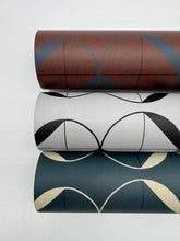 Load image into Gallery viewer, Three rolls of wallpaper with geometric patterns on a white background