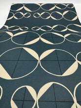 Load image into Gallery viewer, Geometric patterned rug with white shapes on a teal background