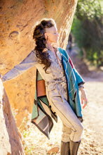 Load image into Gallery viewer, Person in a stylish outfit standing near a rock formation outdoors