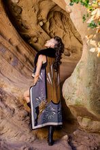 Load image into Gallery viewer, Woman in a dress standing in a natural rock formation
