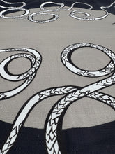 Load image into Gallery viewer, Close-up of a fabric with black and white rope pattern on a gray background
