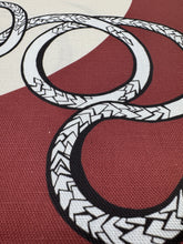 Load image into Gallery viewer, Close-up of woven pattern with interlocking circles on a red and beige background
