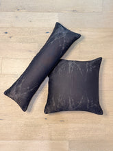 Load image into Gallery viewer, Two dark gray pillows with marble pattern on a light wooden floor.
