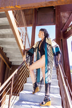 Load image into Gallery viewer, Woman in a stylish outfit standing on stairs with a clear sky background
