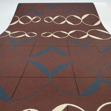 Load image into Gallery viewer, Brown rug with geometric pattern on a white background

