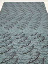 Load image into Gallery viewer, Textured blue rug with wavy pattern on a white background
