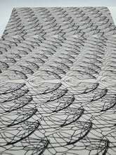 Load image into Gallery viewer, Textile with black leaf-like patterns on a white background
